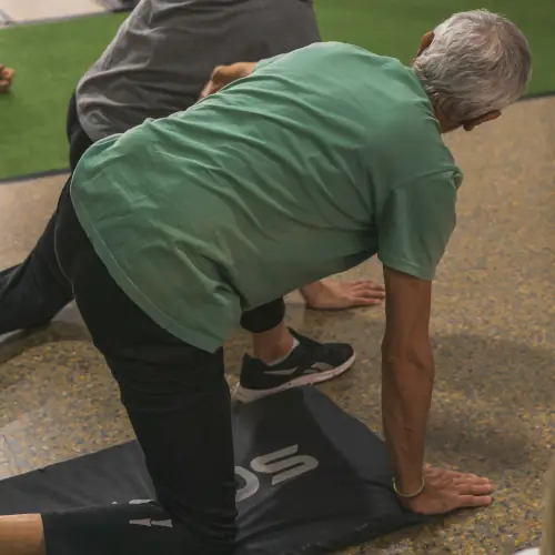 Woman practicing getting up off the floor