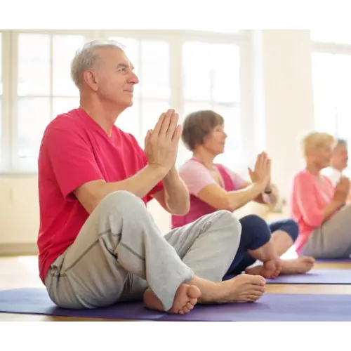 People practicing yoga in a gym